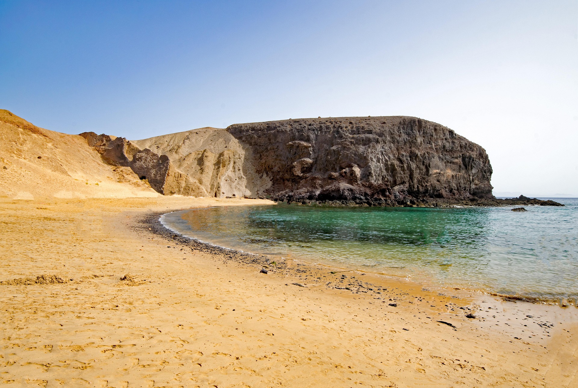 Playa del Risco below the Famara cliffs with La Graciosa beyond - Lanzarote